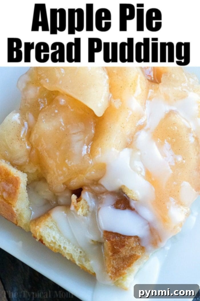 Spiced Apple Pie Bread Pudding 6 Delicious apple pie bread pudding garnished with powdered sugar and a dollop of cream, presented on a white serving plate.