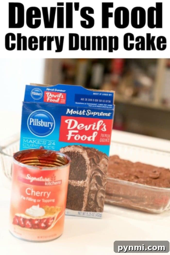 Close-up of baked Chocolate Cherry Dump Cake with a spoonful removed
