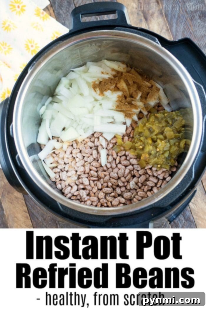 A bowl of healthy Instant Pot refried beans, ready to serve.
