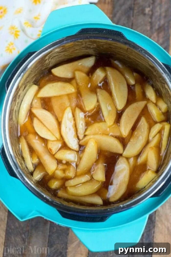 Delicious pressure cooker apple pie filling, perfectly cooked and ready for baking.