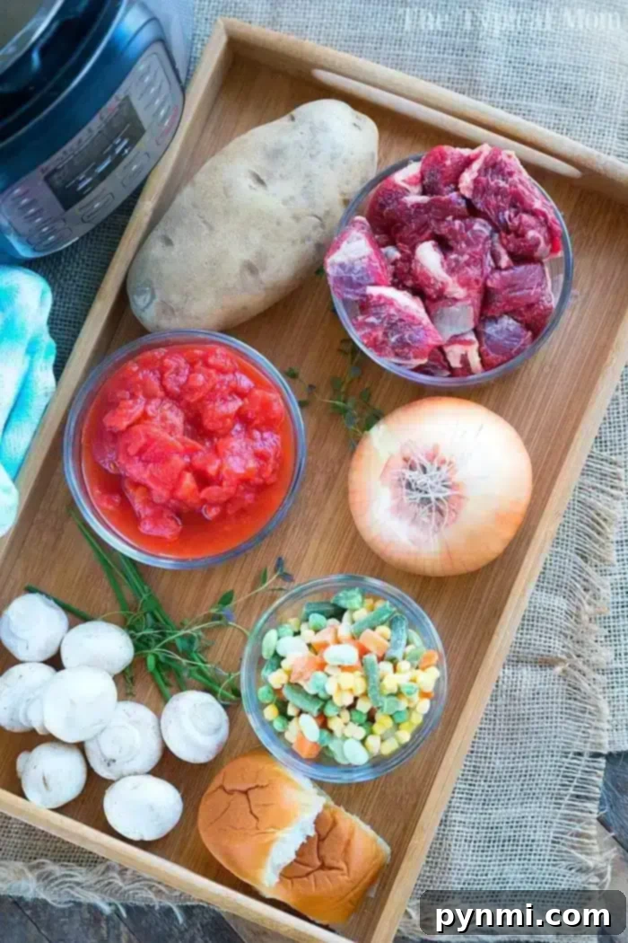 Savory Pot Pie Delight 3 A wooden tray holds the makings of a hearty beef pot pie soup: a whole potato, raw beef chunks, diced tomatoes in a bowl, a whole onion, sliced mushrooms, mixed frozen vegetables, fresh thyme, and a bread roll. An electric pressure cooker is partially visible in the corner.