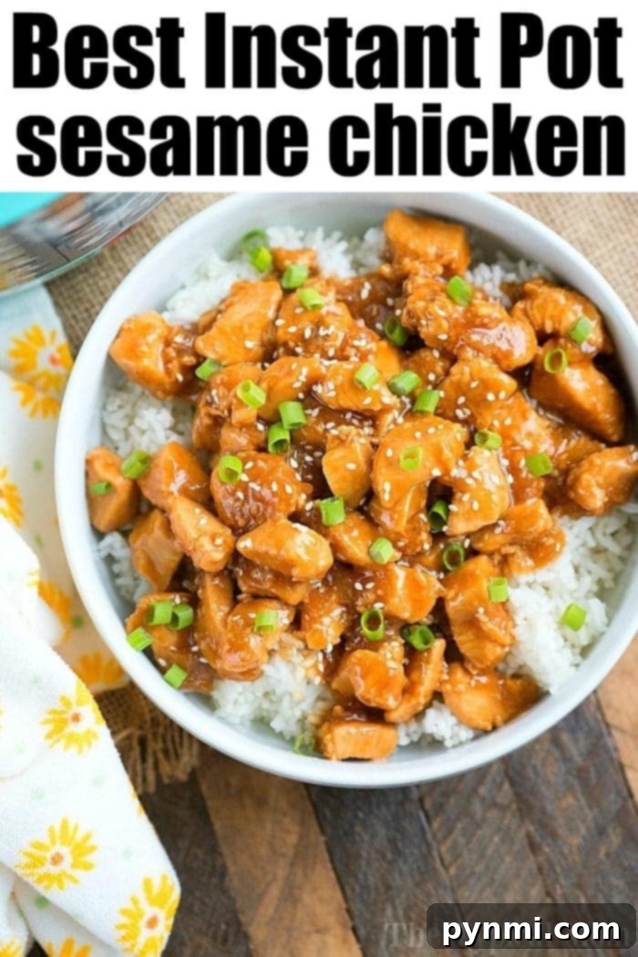 Pressure cooker sesame chicken, perfectly glazed and sprinkled with green onions, rests atop a bed of rice on a wooden surface.