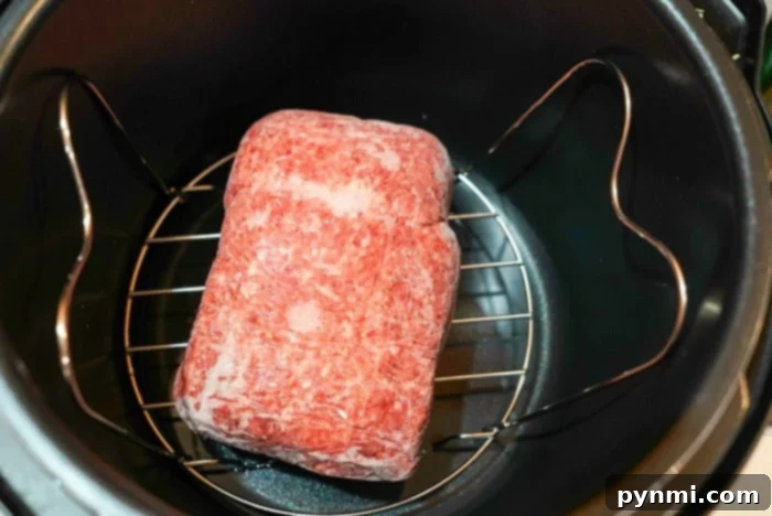 The rendered fat and liquid collected at the bottom of the Instant Pot after thawing frozen ground beef.