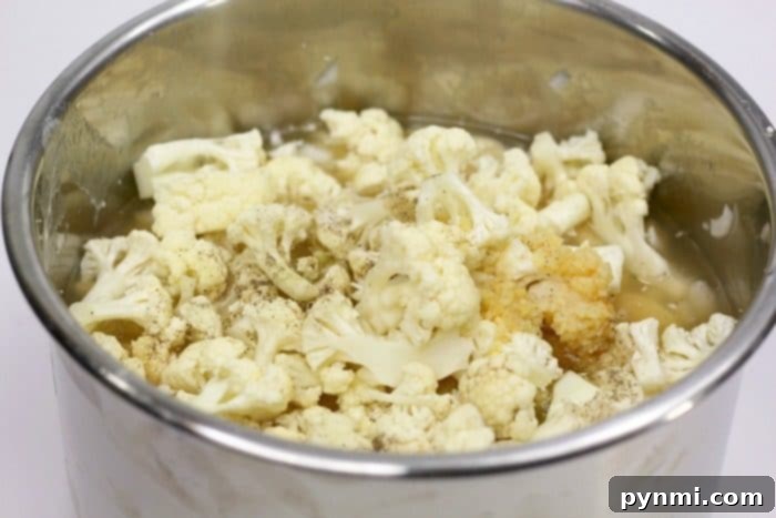 Instant Pot cauliflower soup is a creamy and delicious low carb meal our whole family loves! Easy to throw together keto soup you'll make again and again. #instantpot #instantpotrecipes #cauliflowersoup #keto #pressurecooker #ninjafoodi #crockpotexpress easy cauliflower soup