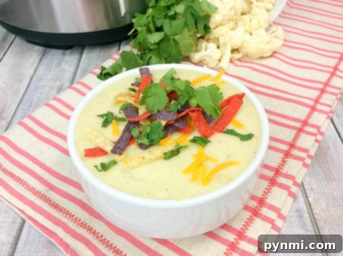 Instant Pot cauliflower soup is a creamy and delicious low carb meal our whole family loves! Easy to throw together keto soup you'll make again and again. #instantpot #instantpotrecipes #cauliflowersoup #keto #pressurecooker #ninjafoodi #crockpotexpress instant pot cauliflower soup