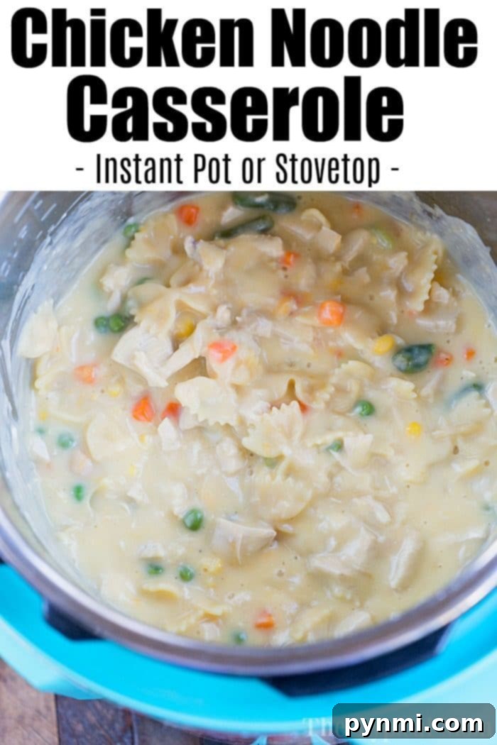 A bowl of creamy, cheesy Instant Pot chicken noodle casserole ready to be served. The texture is thick and comforting, perfect for a family dinner.