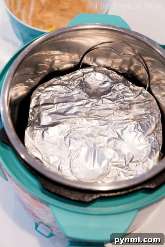 A close-up of churro bites being rolled in a bowl of cinnamon sugar, showing the golden brown texture.