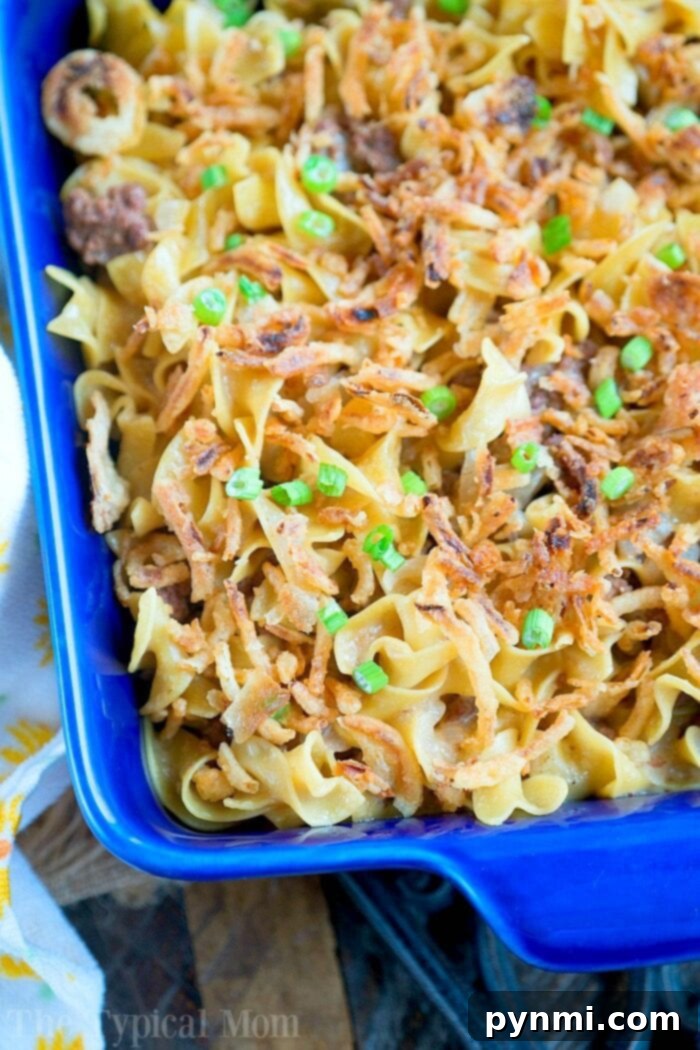 A serving of ground beef stroganoff casserole, showcasing the rich, creamy texture and generous portion size, ready to be enjoyed.