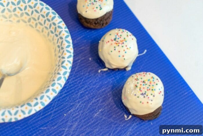 Close-up of homemade donut holes, freshly made and ready for creative decoration with frosting and various toppings.