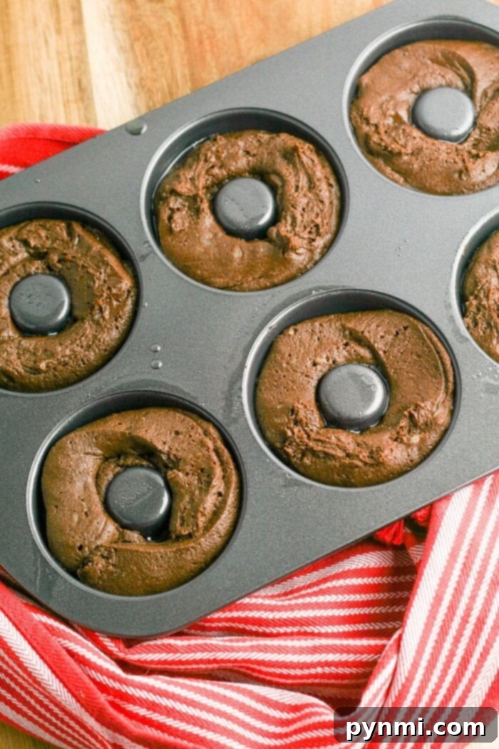 Perfect your gluten-free baking with these delectable donut holes, made easily in your oven or pressure cooker for a sweet treat. Gluten-Free Baked Donut Holes Ready for Glazing