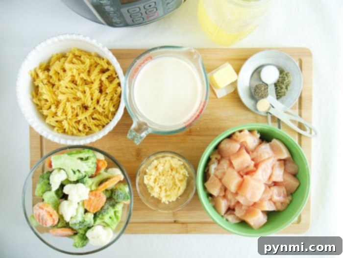 A close-up of creamy Instant Pot chicken and noodles, showcasing the rich sauce and perfectly cooked pasta strands.