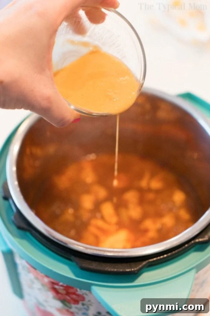 Instant Pot Hawaiian chicken is pineapple sweet with a bit of a kick. Served on top of rice or by itself it's one of our favorite pressure cooker dinners! #instantpotrecipes #instantpot #chicken #pineapple #hawaiian #sweet #thetypicalmom #ninjafoodirecipes pressure cooker hawaiian chicken