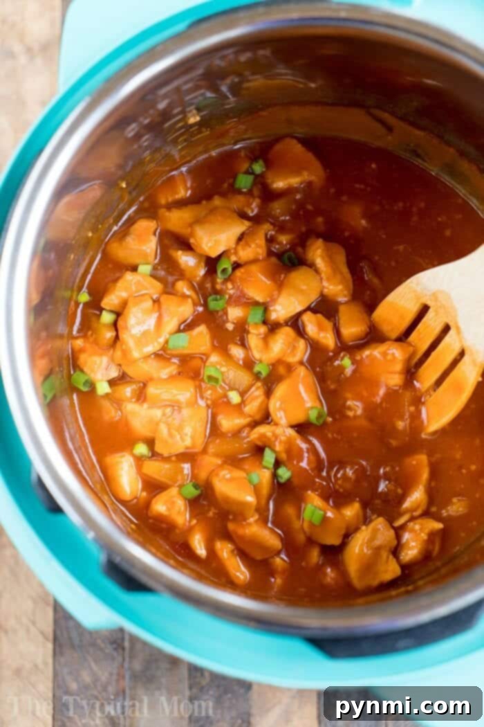 Instant Pot Hawaiian chicken is pineapple sweet with a bit of a kick. Served on top of rice or by itself it's one of our favorite pressure cooker dinners! #instantpotrecipes #instant pot #chicken #pineapple #hawaiian #sweet #thetypicalmom #ninjafoodirecipes pressure cooker pineapple chicken
