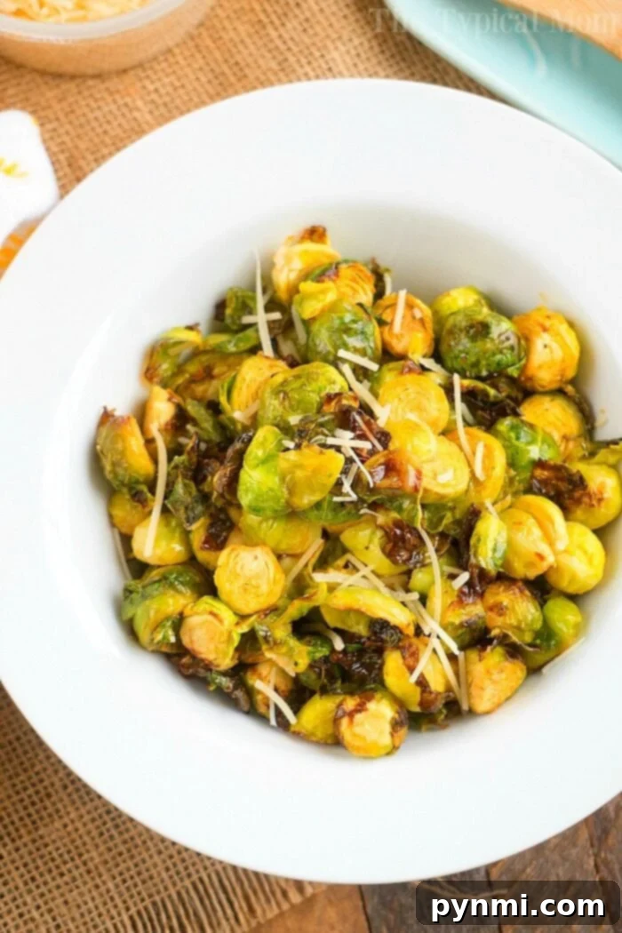 Brussel sprouts in the air fryer are just amazing! Tender brussels with a bit of a crispy outside will get you to love this understated vegetable. #brusselsprouts #brusselssprouts #airfryer #airfryerbrusselsprouts #lemon #healthy #thetypicalmom The ultimate recipe for air fryer Brussels sprouts, seasoned to perfection.