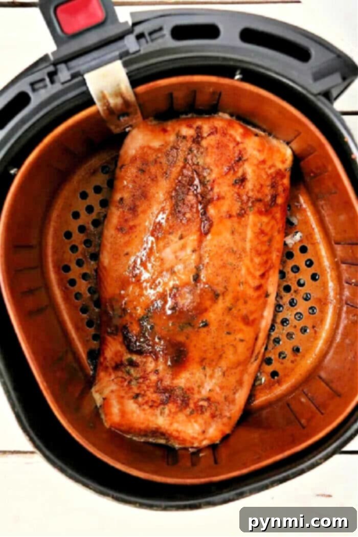 Air Fryer Salmon: Your Easiest Dinner Yet 2 Perfectly cooked salmon fillet in an air fryer with dry rub