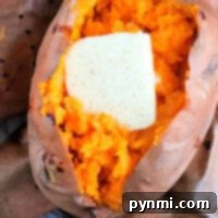 Air Fryer Sweet Potato Perfection 4 Baked sweet potato in the air fryer topped with a pat of melting butter, revealing vibrant orange flesh.