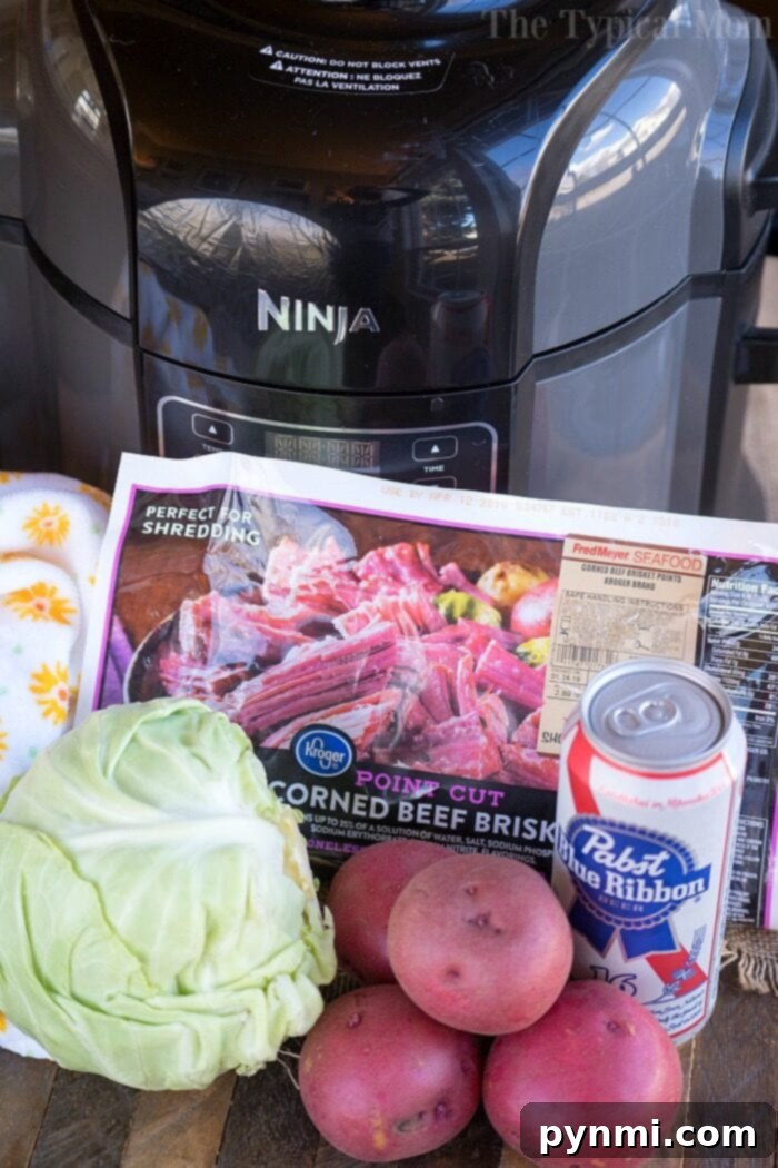 Ninja Foodi corned beef and cabbage is perfect for St Patricks Day or year round. Tender corned beef brisket in a little over an hour is here! #ninjafoodirecipes #ninjafoodi #cornedbeefandcabbage #brisket #cornedbeef #thetypicalmom On a wooden table sits a tempting array: cabbage, red potatoes, canned beer, and a corned beef brisket package. Perfect for creating the ultimate Ninja Foodi corned beef and cabbage feast.