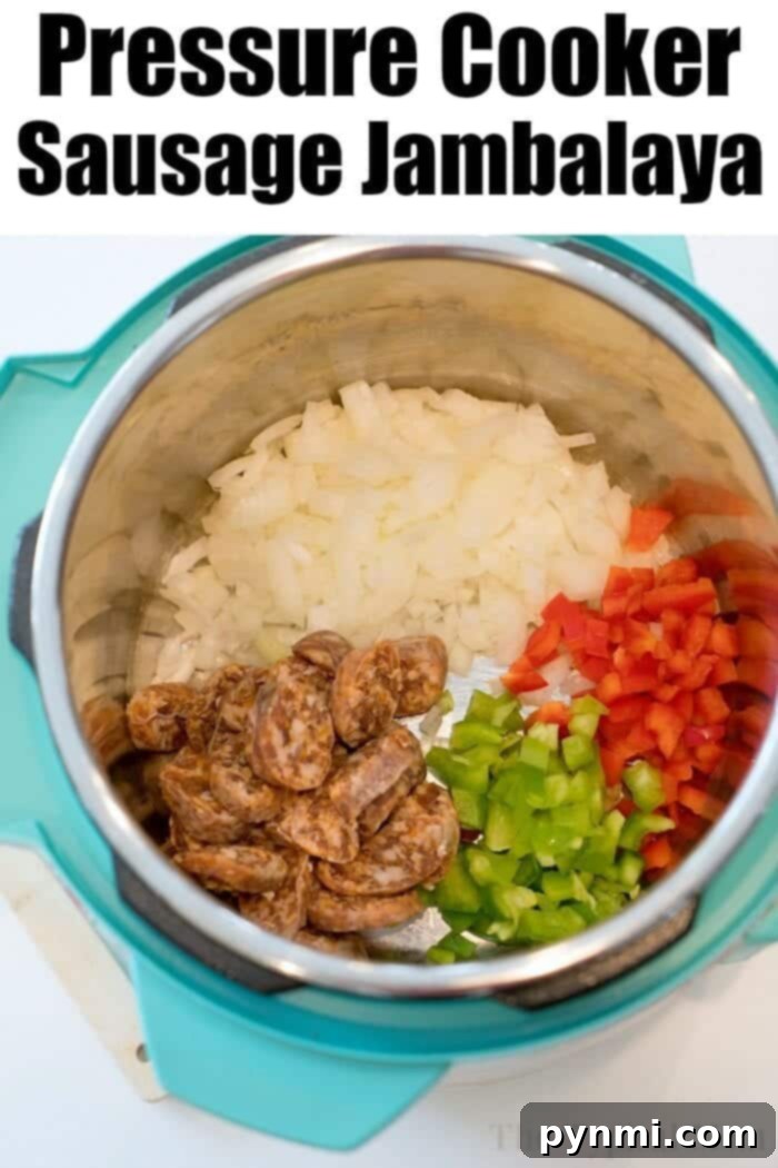 A large spoonful of pressure cooker jambalaya, showing the perfectly cooked rice, sausage, and vegetables, garnished with fresh green onions