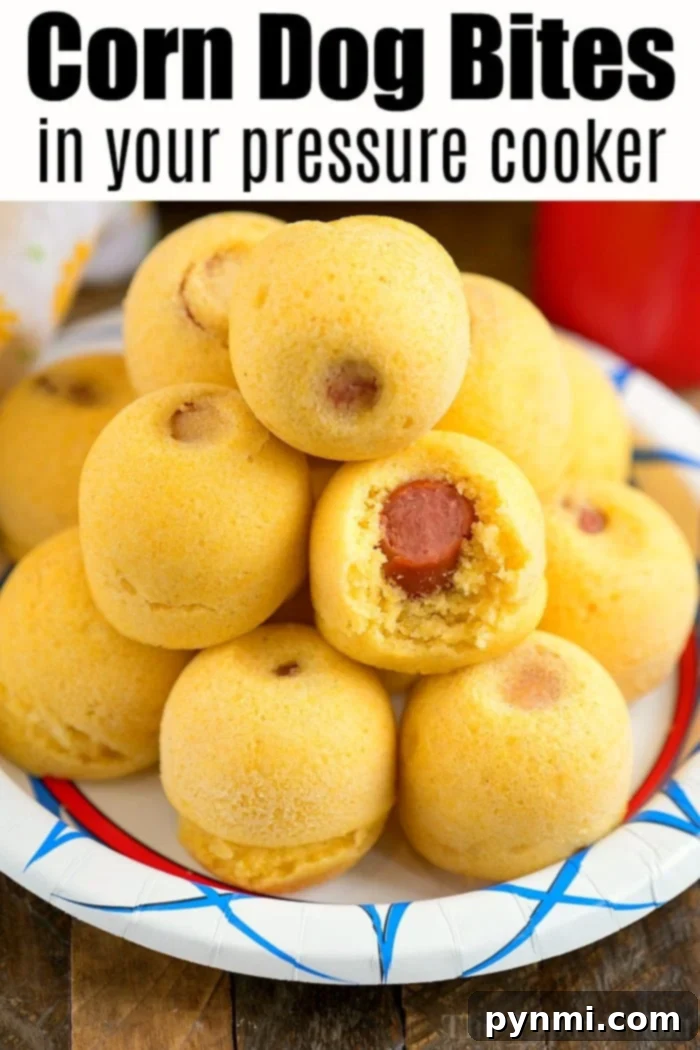 Pressure cooker corn dog bites are easy to make in your Instant Pot, Crock Pot Express or Ninja Foodi! The perfect snack or lunch your kids will love. #instantpotrecipes #instantpot #ninjafoodi #ninjafoodirecipes #corndogs #eggmold #pressurecooker #snacks #lunch #corndogbites Pressure cooker corn dog bites, fresh from the mold, showcasing their fluffy cornbread texture.