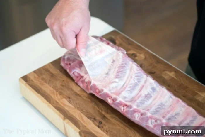 Final step of removing ribs membrane, showing a clean separation from the bone