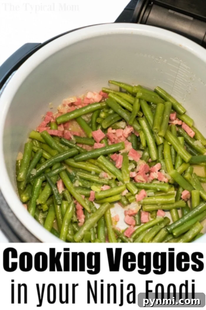 A large serving of pressure-cooked green beans with bacon, showcasing a hearty and flavorful dish.