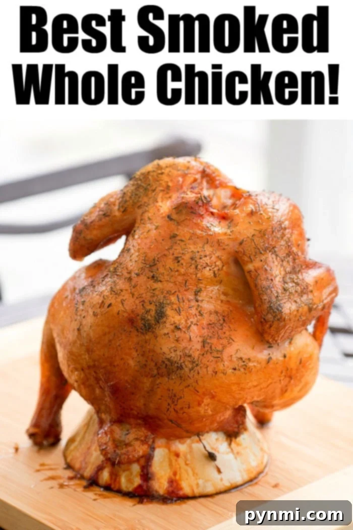 Smoked Beer Can Chicken - A perfectly golden-brown chicken standing upright on a smoker, ready to be enjoyed.
