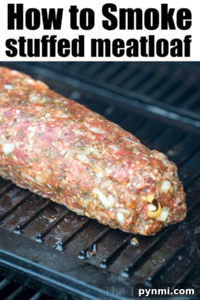A step-by-step image of smoked meatloaf preparation. It shows the meat mixture spread flat on parchment paper, topped with shredded cheese and bacon, ready to be rolled. This visual guide helps in understanding how to stuff and roll meatloaf for smoking.