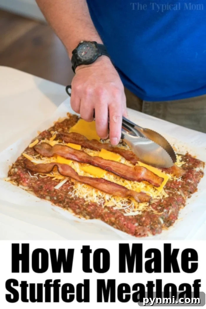 A slice of smoked meatloaf with melted cheese and bacon, served on a cutting board, ready to be enjoyed. The rich brown crust and visible succulent interior highlight the success of this cheese-stuffed meatloaf recipe, perfect for comfort food lovers.