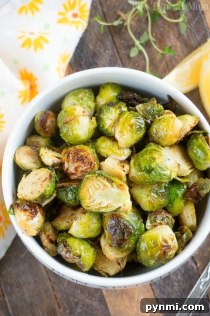 A bowl of roasted Brussels sprouts, perfectly crisped in an air fryer