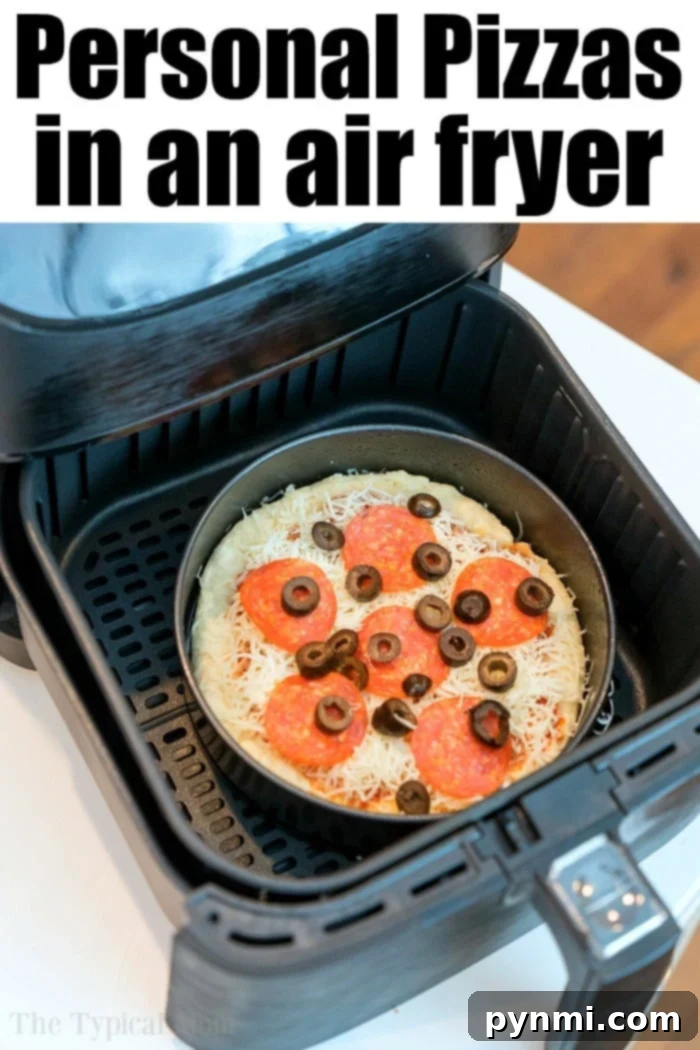 An open air fryer revealing a personal pizza with cheese, pepperoni, and black olives.