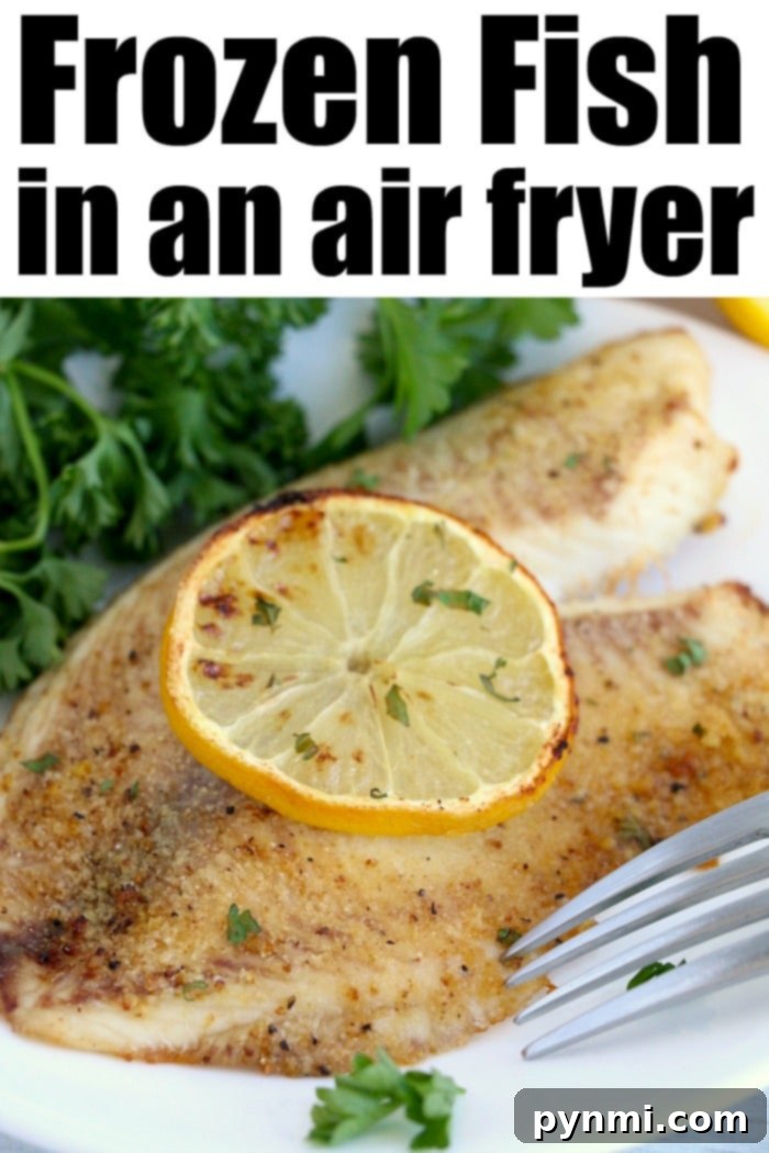 Cooked fish fillet topped with lemon and parsley, ready to serve