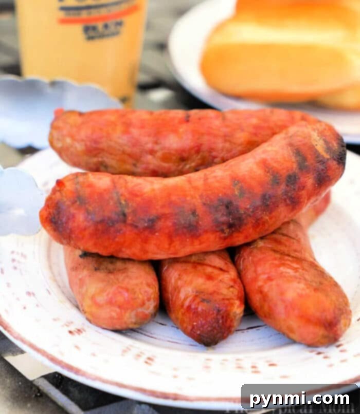 Perfectly cooked Traeger smoked brats on a grill grate