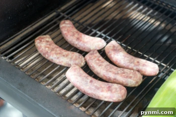 Close up of a smoked sausage with a fork