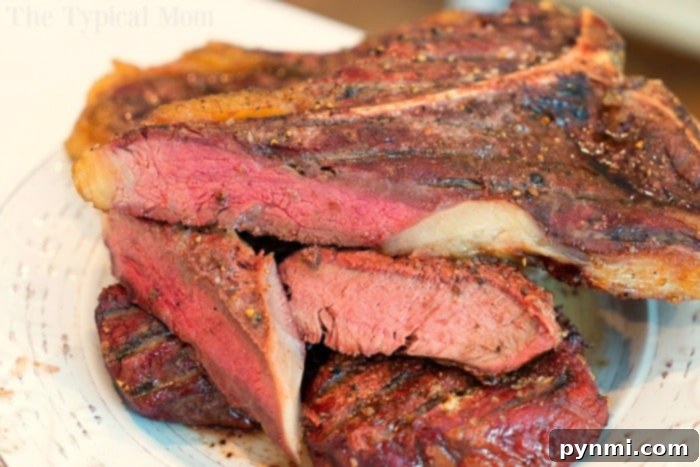 How to smoke steaks. Smoked steak slices served on a plate, showing the rich, smoky color and tender texture.