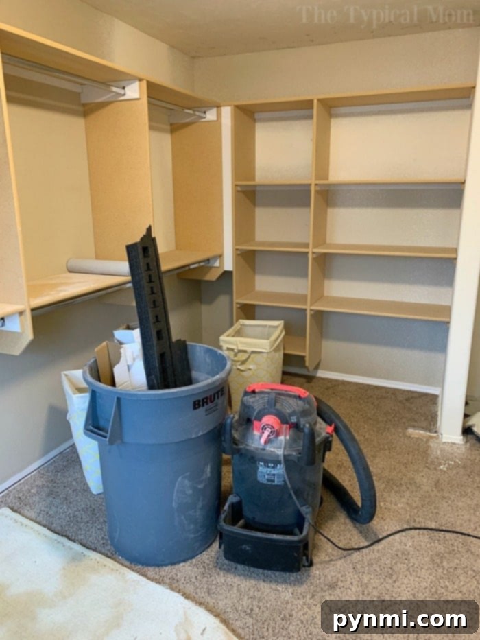 The custom-built closet system taking shape with shelves and hanging rods.