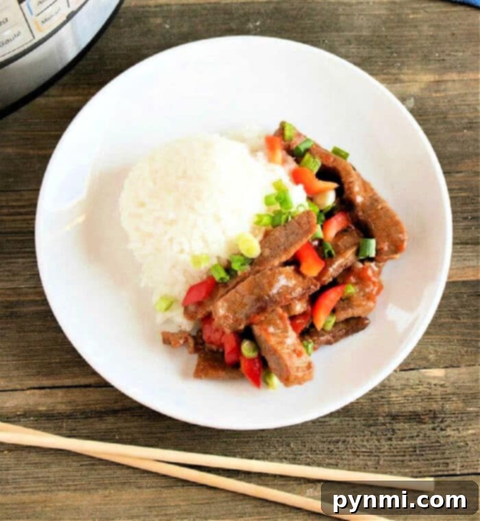 chinese-pepper-steak, tender beef strips, vibrant bell peppers, rich sauce, pressure cooker meal