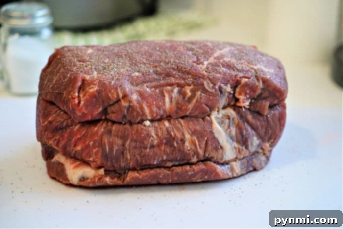 Succulent Ninja Foodi Roast Beef 3 Close-up of a beautifully cooked roast, ready to be sliced or shredded.