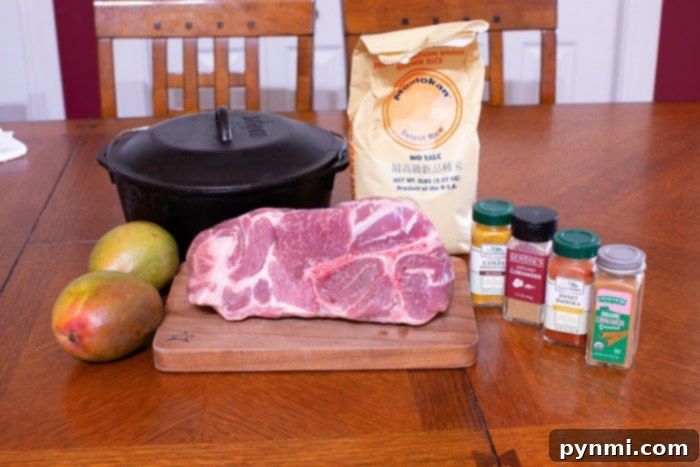 Succulent Braised Pork Roast 3 Two pieces of perfectly seasoned pork roast resting in a black cast iron skillet, ready to be pulled or sliced, a testament to Dutch oven recipes.