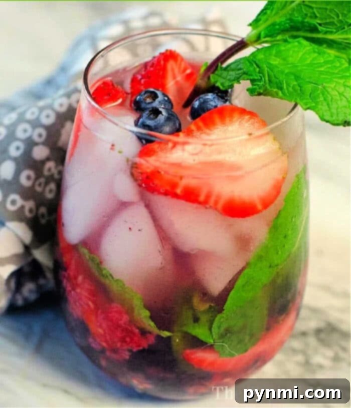 A refreshing mixed berry mojito, perfect for any occasion.