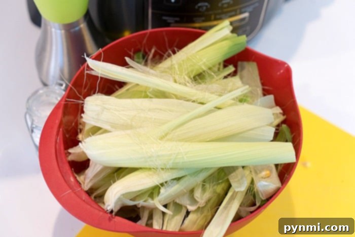 A pile of corn husks, suggesting their use for composting or other creative purposes after air frying corn on the cob.