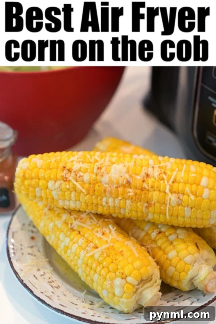 Delicious Mexican street corn (Elote) with creamy sauce and cheese on an air-fried cob, ready to be enjoyed.