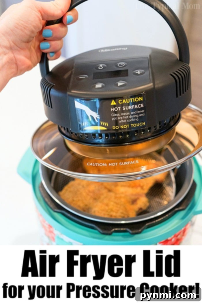 Transform your pressure cooker into an air fryer with ease and achieve perfect crispiness every time! The MICHELANGELO Air Fryer Lid securely placed on a pressure cooker, ready to crisp food
