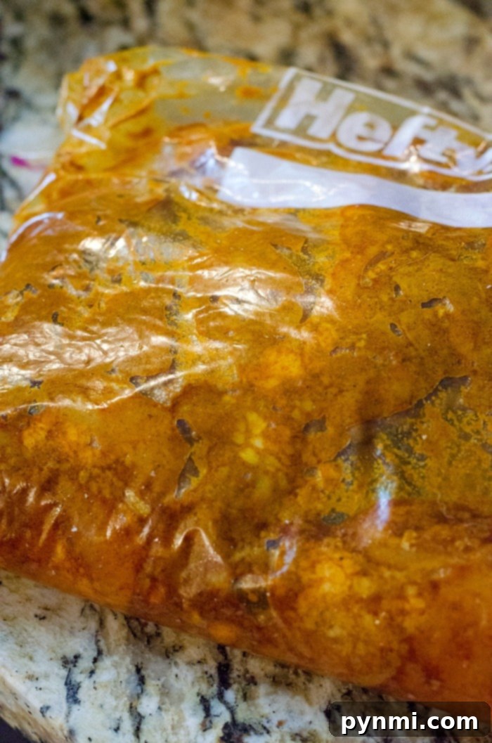 Chicken shawarma marinade with rich spices and herbs, ready for tender chicken thighs