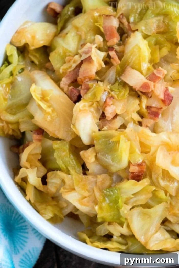 A vibrant close-up of a prepared Instant Pot cabbage dish, showcasing tender green cabbage leaves intertwined with other ingredients, garnished with fresh herbs, ready to be served from a rustic bowl.