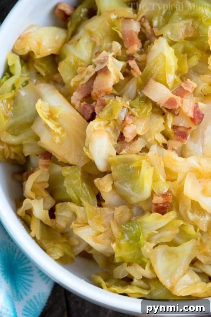 A generous serving of Pressure Cooker Fried Cabbage, with perfectly browned, tender cabbage leaves and savory bacon bits, ready to be enjoyed as a side dish.