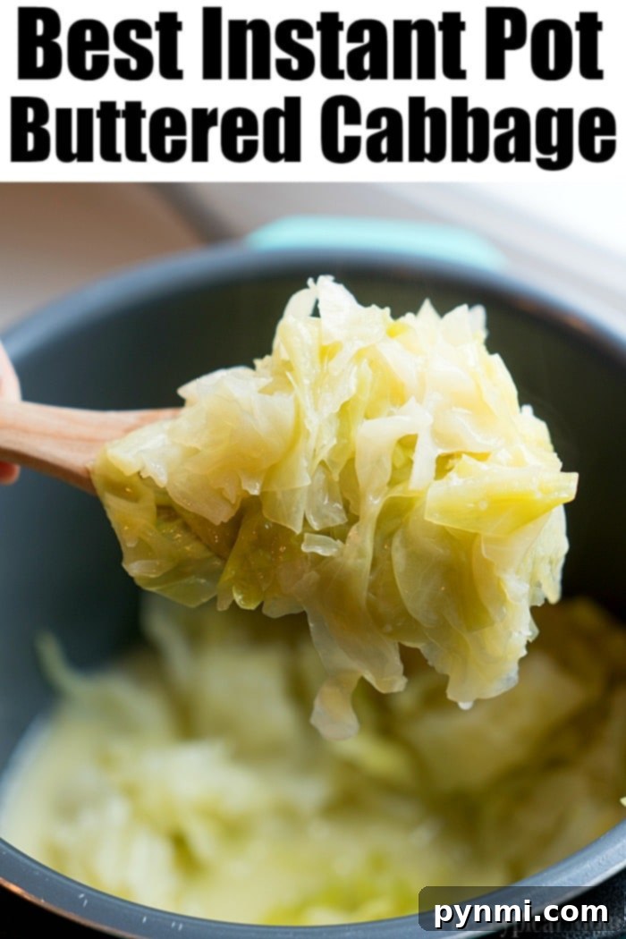 A close-up of a serving of Instant Pot buttered cabbage, with tender, vibrant green cabbage wedges glistening with melted butter and sprinkled with fresh herbs.
