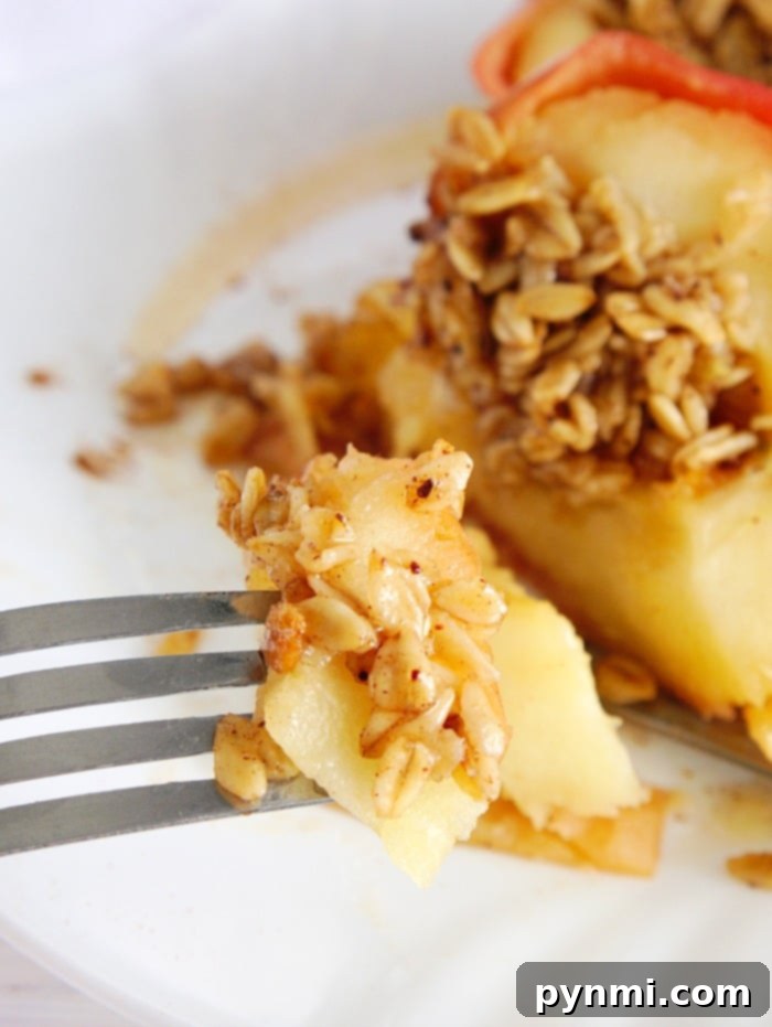 Perfectly baked apples in a Crockpot Express, ready to be enjoyed as a healthy and delicious dessert.