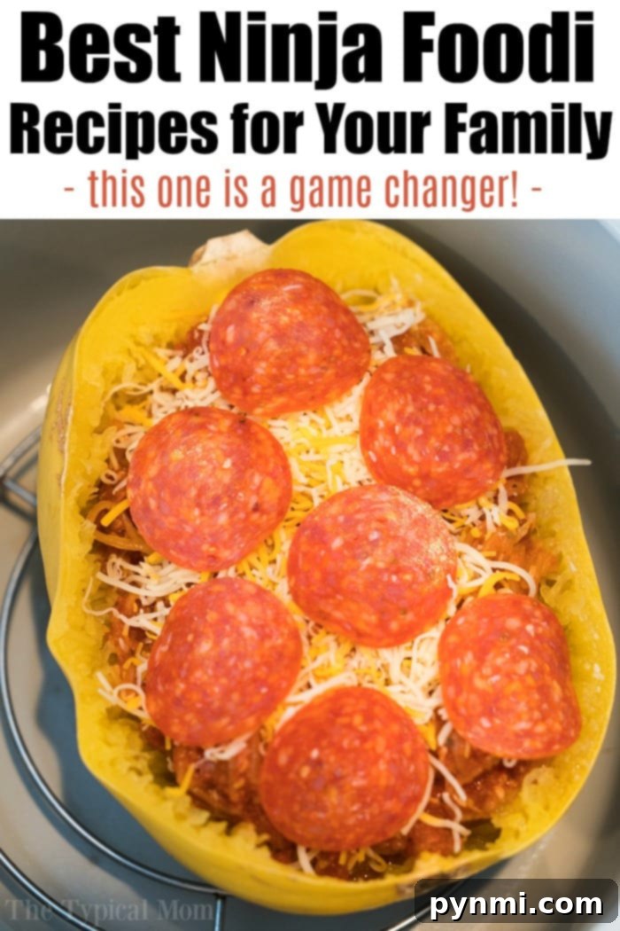 Finished Ninja Foodi spaghetti squash pizza with pepperoni, melted cheese, and fresh basil garnish, ready to eat.
