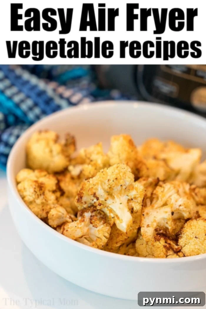 Air fryer cauliflowe. Healthy and full of flavor it's a great vegetable side dish or snack. #airfryer #ninjafoodi #cauliflower #vegetables #vegetarian #sidedish Beautifully air-fried cauliflower florets seasoned to perfection, scattered in an air fryer basket.