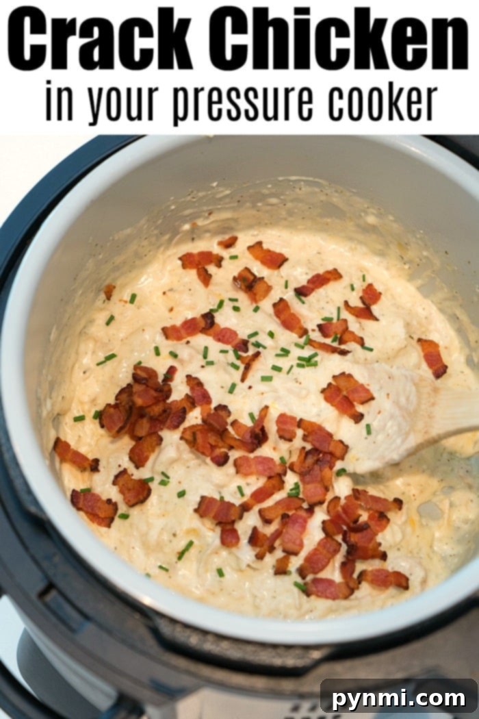 Pressure cooker crack chicken dip. #instantpot #ninjafoodi #crackchicken #pressurecooker Close-up of a Ninja Foodi pressure cooker filled with creamy chicken topped with crispy bacon bits and chopped chives. The text reads Crack Chicken made easy. A wooden spoon rests in the mixture, ready to serve a delicious meal.